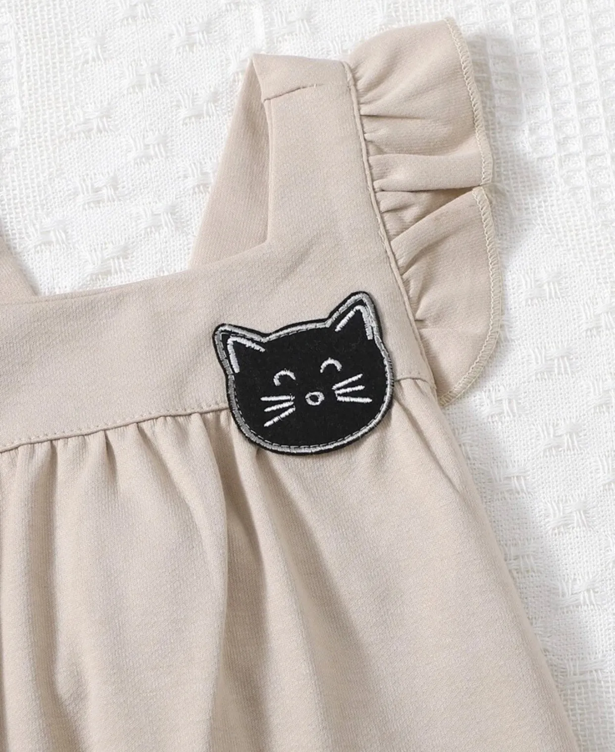 Khaki colored baby girl cartoon patched ruffle trim jumpsuit